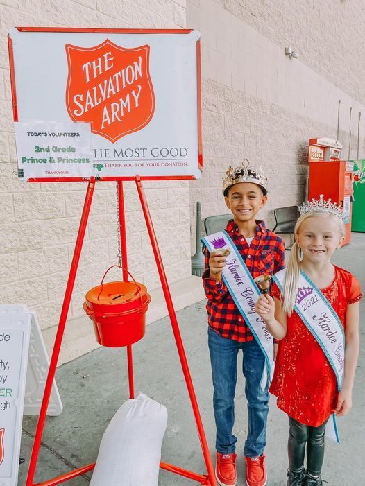 children with Salvation Army bucket