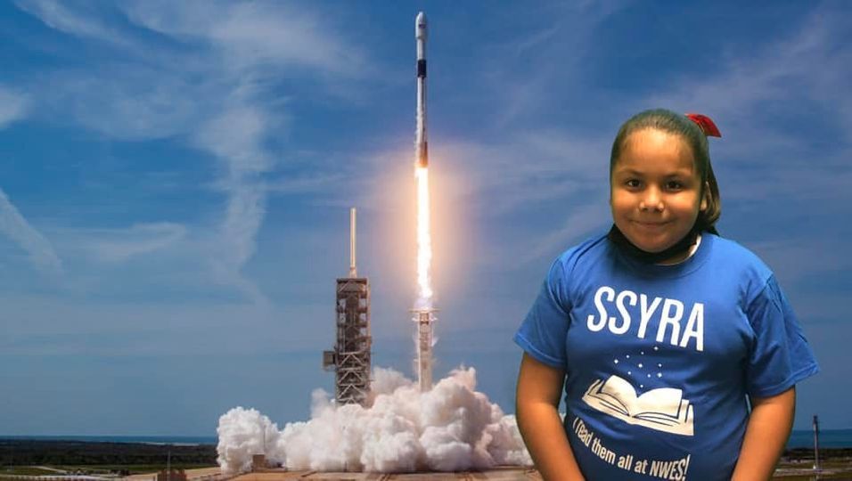 girl in front of rocket launch